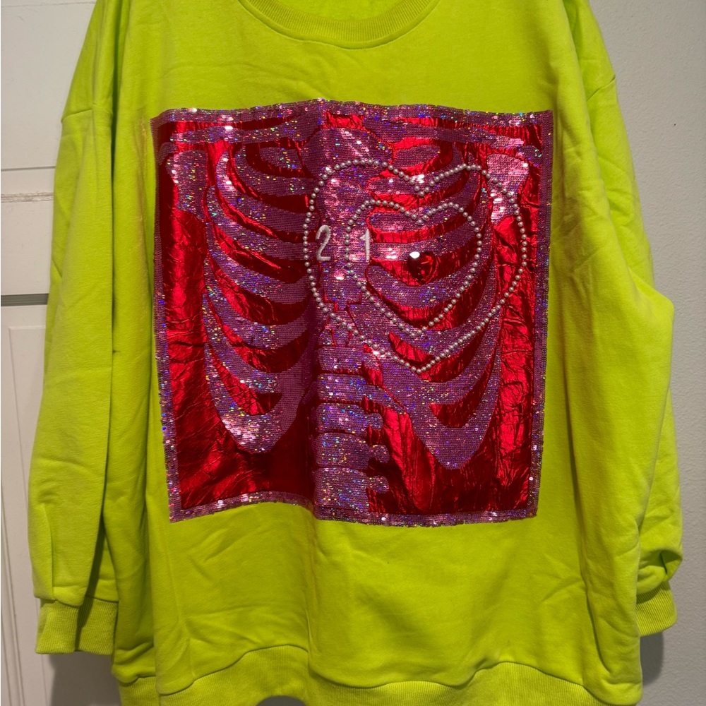 QUEEN OF SPARKLES Grinch Neon Green Sweatshirt with Red Sequin Ribcage Design